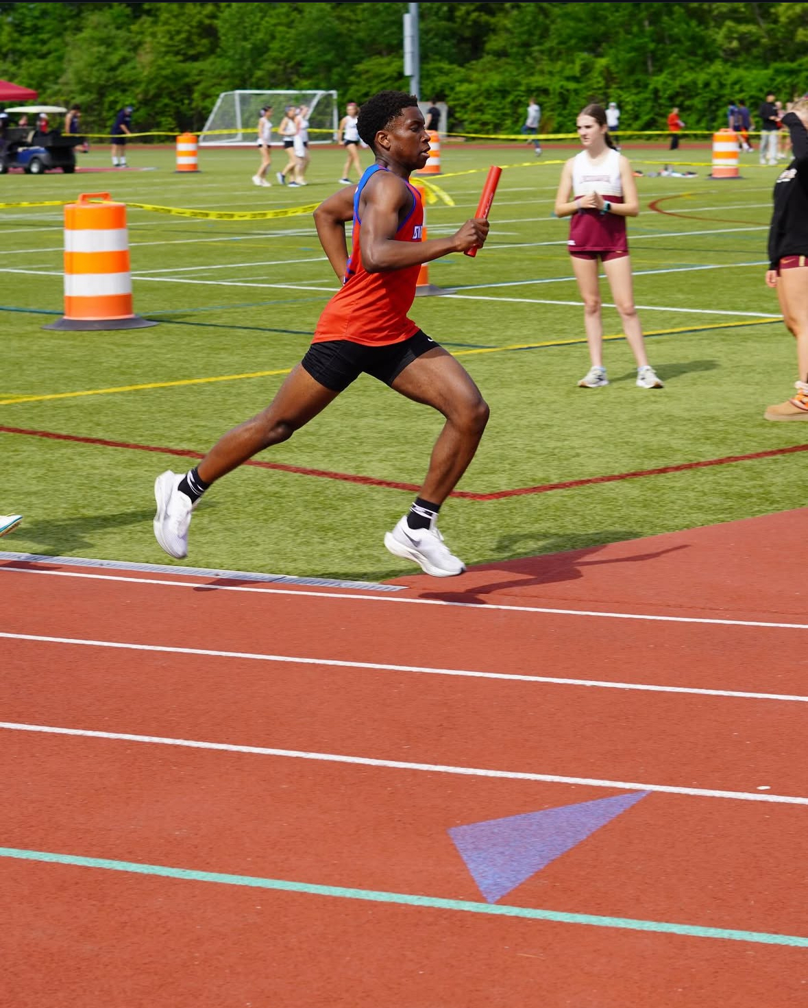 Roy Kanyike running relay race